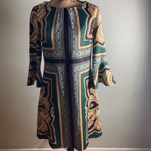 NY&Co. multi-print stretch dress with bell sleeves and back zipper.